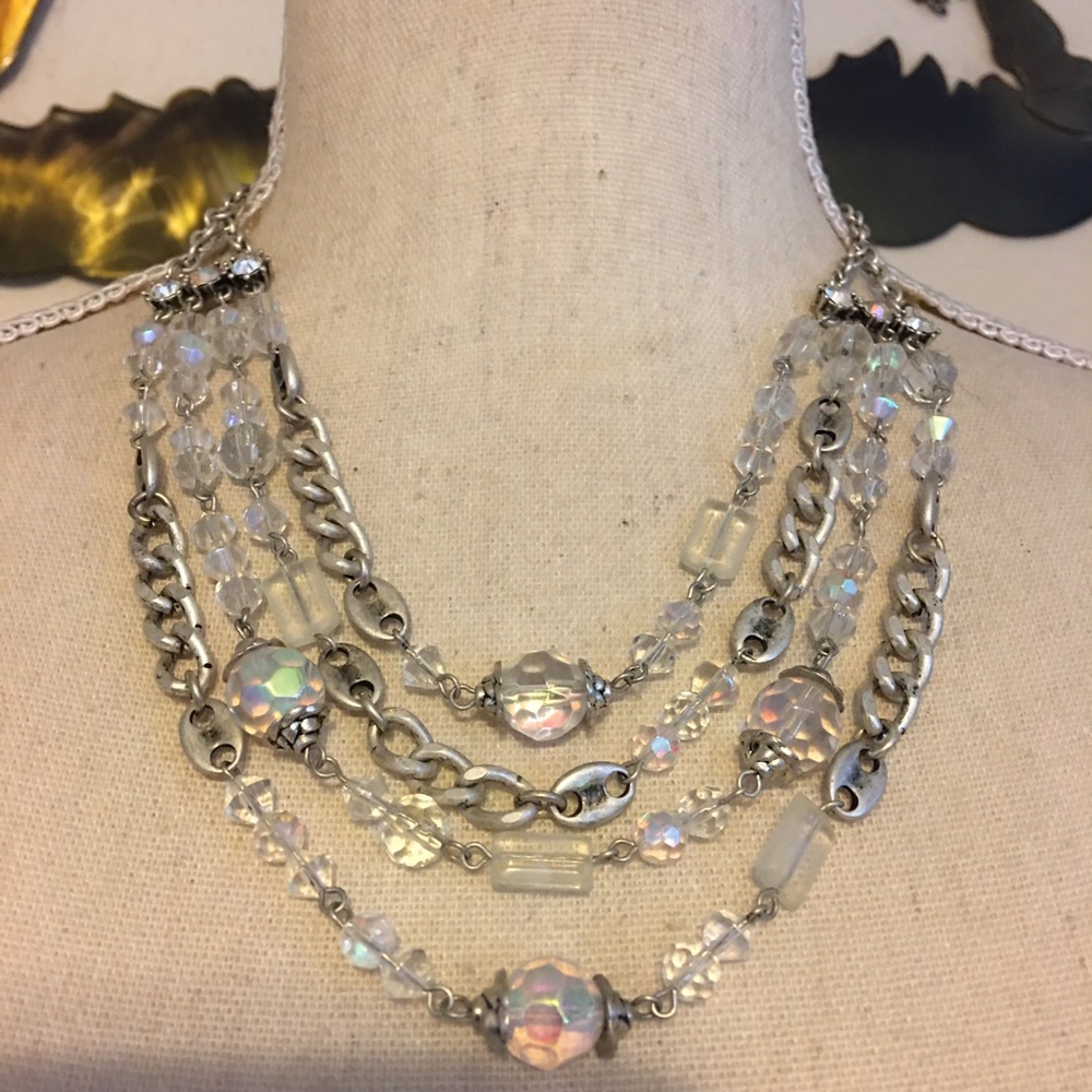Four strand layered opalescent bead necklace